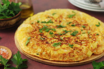 Frittata, traditional egg and potato omelette, Italian dish