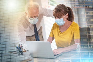 Businesspeople wearing protective medical mask in office during coronavirus outbreak; multiple...