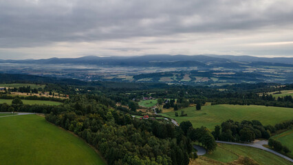Aerial view of czech and polish mountains during cloudy day.