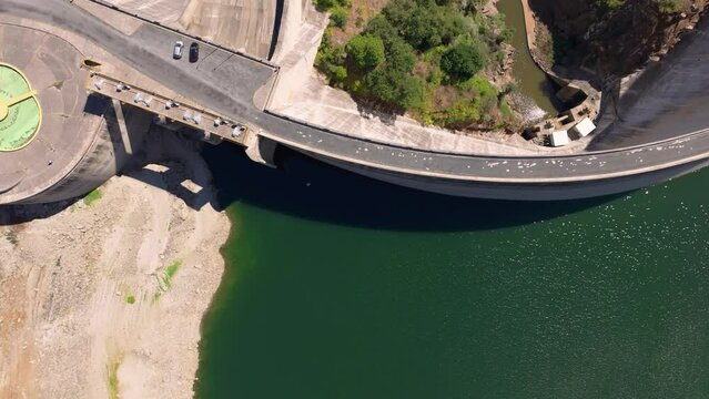 Overhead View Of Belesar Reservoir Crest - Concrete Roadway Over The Dam. - aerial 