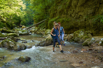 Woman hikers exploring a gorge