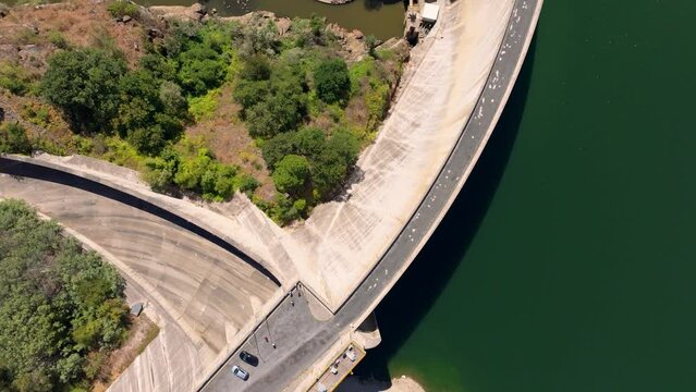 Flying Above Concrete Wall Of Belesar Dam On Minho River In Lugo, Spain. aerial topdown
