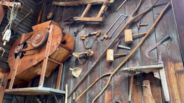 Video of a bunch of farming tools on a wooden wall in Switzerland