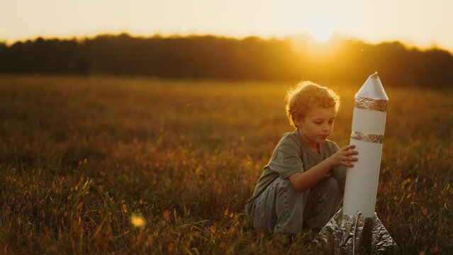 Little Boy Playing With Toy Rocket Made By Paper In Field In Summer, Throwing Spaceship to Air