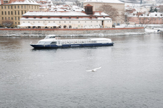 Prague historical beautiful Landmarks in Pictures in winter time with boat and vltava river