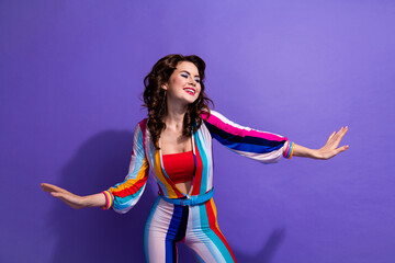 Photo of pretty adorable girl dressed striped overall dancing having disco fun isolated violet color background