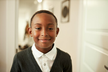 Back to school concept. Happy delighted teen african american boy in stylish cardigan and white...