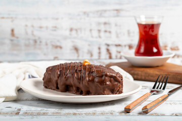 Chocolate and peanut cake. Peanut cake with fresh caramel filling on a plate