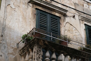 old window in the old house, balcony
