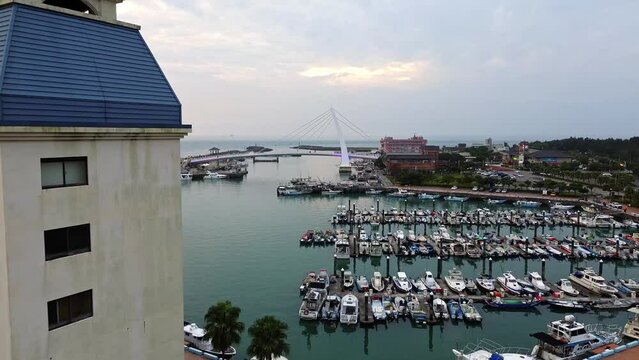 Aerial 4k footage of the Tamsui Fisherman's Wharf Harbor in New Taipei City, Taiwan.