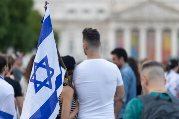 Lisbon, Portugal October 10, 2023. People at a rally in support of Israel hug and hold Israeli flags