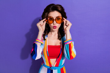 Photo of cool impressed lady wear striped overall dark glasses pouted lips isolated purple color background