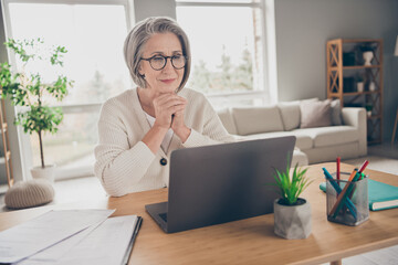 Photo of pretty charming senior lady dressed white cardigan reading news apple samsung modern gadget indoors house room