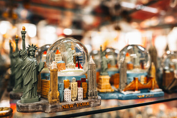 Famous traditional gifts and souvenirs Statue of Liberty with American flag in a store in...