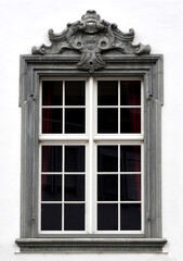 Black-rimmed windows of a Swiss commercial building on white background
