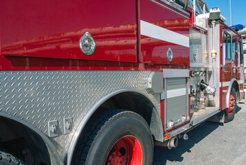 Compartments of a fire truck containing equipment for extinguishing fires and rescuing people. A...