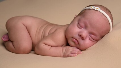 Sleeping newborn cute baby girl or boy during first week of life. 4k slow motion120 fps raw video. Happy family concept. Small baby sleep in bed with small bear toy in hand and nipple