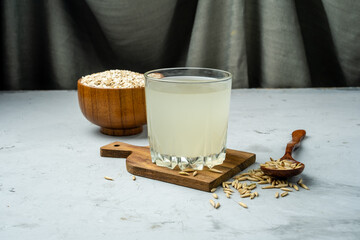 Fermented healthy drink from oats in a glass glass. Kvass from oats.
