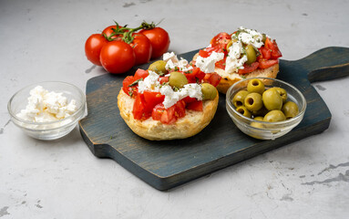 Delicious appetizer of ripe tomatoes and olives and feta cheese, Greek dish