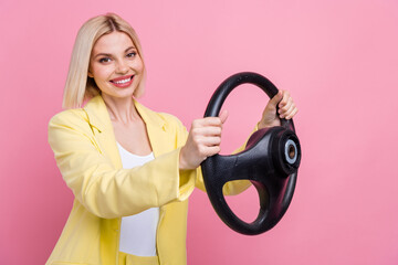 Profile photo of elegant gorgeous cheerful person toothy smile hands hold wheel isolated on pink...