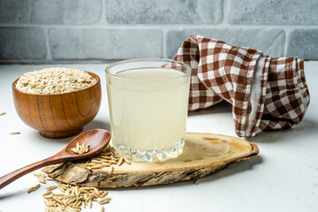 Healthy fermented drink, oat infusion, glass of drink.