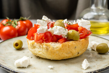 toasted bun with tomatoes and feta cheese, Dakos-Greek cuisine.
