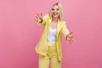 Fototapeta na wymiar Photo of cheerful positive woman dressed blazer suit open arms ready hug you isolated pink color background