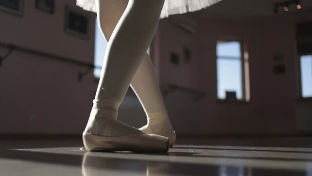 Dancing ballerina, dancer's feet, ballet elements, pirouette