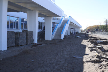 Damaged asphalt road with potholes. Bad road. Repair. Patch repair of asphalt. Bad asphalt dangerous, Broken automobile road, cracks, holes, potholes in asphalt 