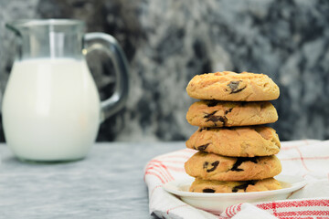 Homemade chocolate chip cookies, Cookies and a jug of milk
