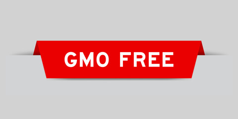 Red color inserted label with word GMO (abbreviation of Genetically Modified Organisms) free on gray background