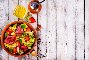Iberian Ham, Strawberries and vegetables. Restaurant menu, dieting, cookbook recipe top view.