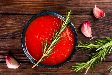 Tomato sauce with spice in black bowl