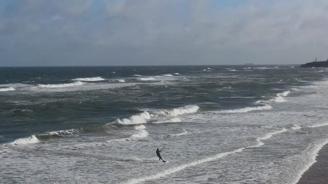 High Angle Footage of Kite surfing over Beach and Ocean of Northumberland England UK. The Footage Was Captured with Drone's Camera on Jan 24th, 2021