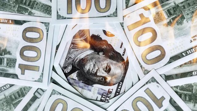 Dollars with Washington in fire, money background, world financial crisis concept