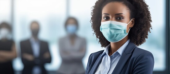 African American woman with mask leading office team - obrazy, fototapety, plakaty