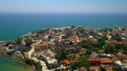 Aerial drone video of Antalya Side, showing Turkey's beautiful coastal landscape, ancient ruins and charming seaside town.