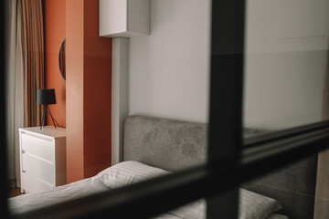 Modern bedroom interior, lamp on the nightstand