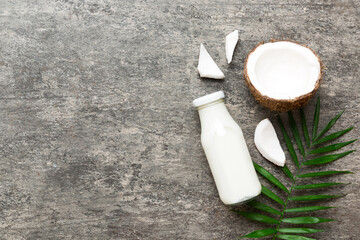 coconut products on white wooden table background. Dairy free milk substitute drink, Flat lay healthy eating