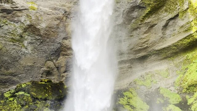 Massive waterfall falling from a cliff in Iceland