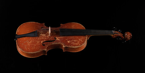 Fototapeta premium old violin isolated on black background