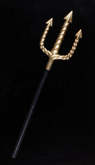Golden Trident isolated on black background