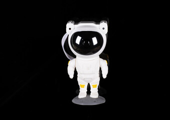 astronaut toy isolated on black background
