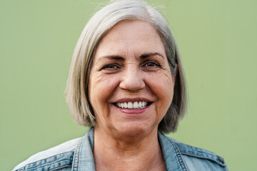 Happy senior woman smiling in front of camera - Elderly people lifestyle concept - 661525956