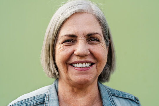 Happy senior woman smiling in front of camera - Elderly people lifestyle concept