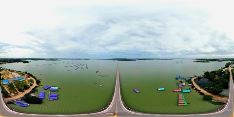 360 degree aerial photograph of a bridge over a reservoir.