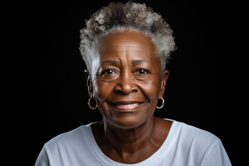 African american senior woman in white t-shirt on dark gray background
