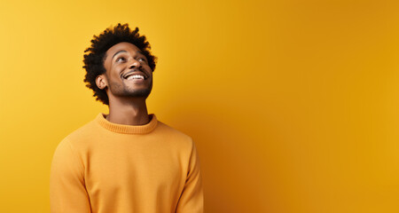 Monochromatic Portrait: Black Man in Yellow Sweater Against Yellow Backdrop - Ideal for Cohesive Design & Fashion Statements