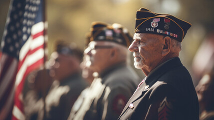 A group of veterans standing in formation, saluting the flag during a solemn ceremony, with copy space, blurred background - obrazy, fototapety, plakaty