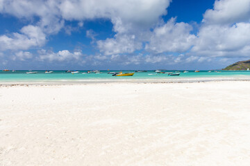 White empty beach white sand under blue sky on a sunny summer day. Seychelles